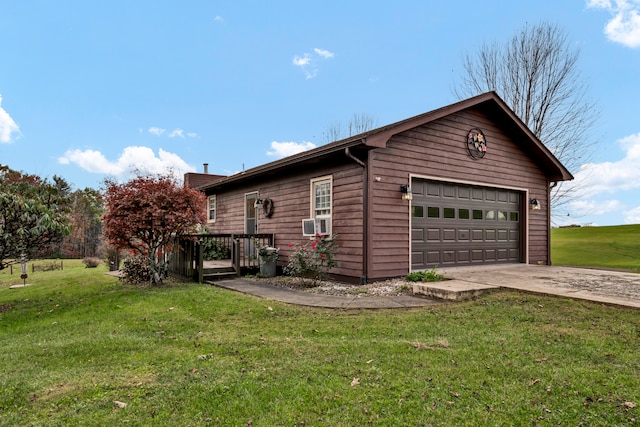 view of side of property with a lawn and a garage