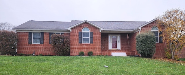 ranch-style house featuring a front lawn