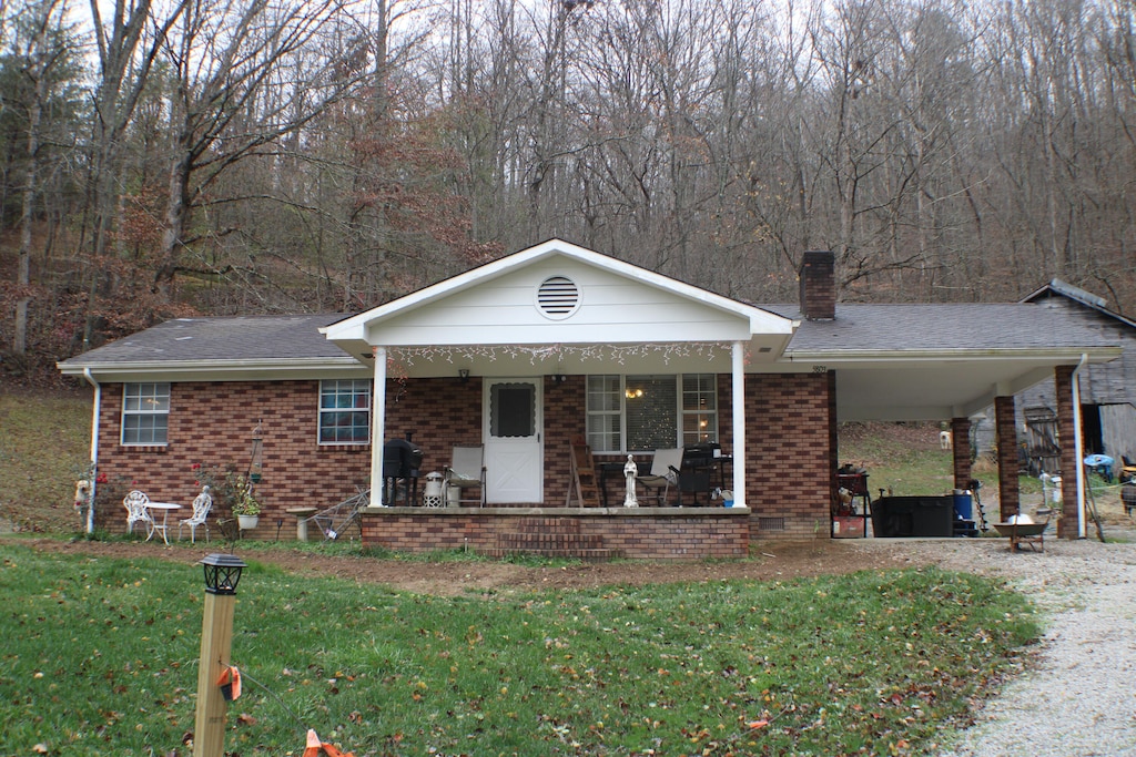 view of front of home with a front lawn and a porch