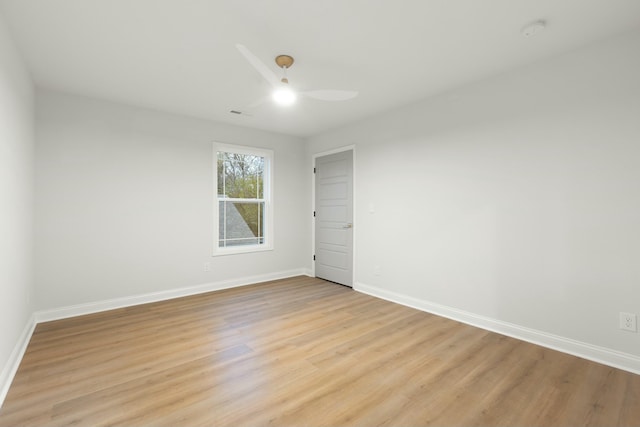 empty room featuring ceiling fan and light wood-type flooring