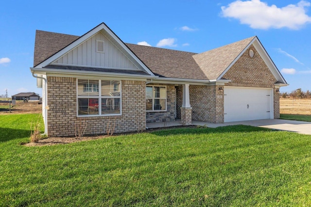 view of front of property featuring a garage and a front lawn