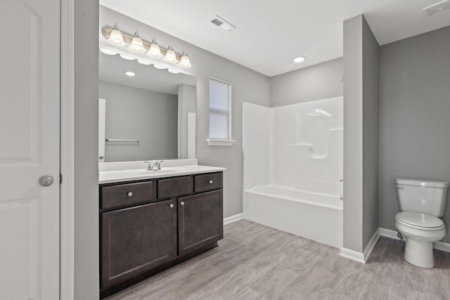 full bathroom featuring vanity, shower / washtub combination, and toilet