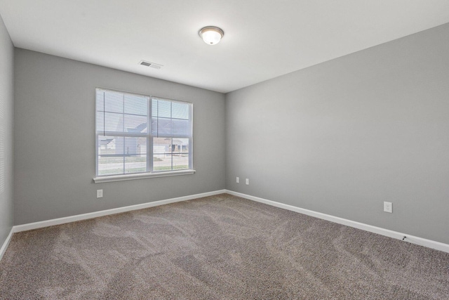 unfurnished room featuring carpet floors