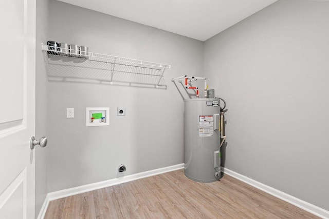 clothes washing area with washer hookup, electric water heater, hardwood / wood-style floors, and hookup for an electric dryer