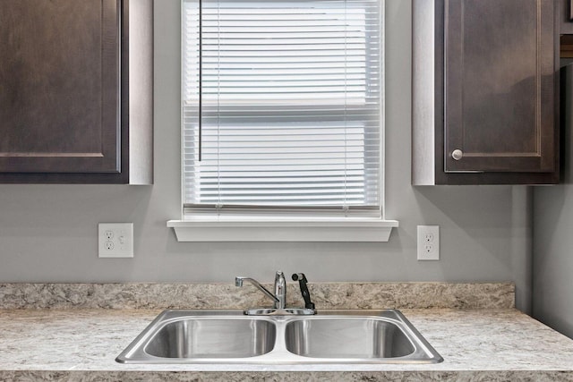 kitchen with sink and dark brown cabinets