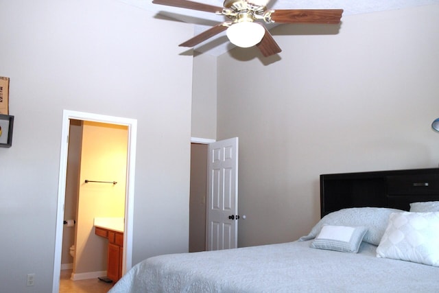 bedroom featuring ensuite bath and ceiling fan