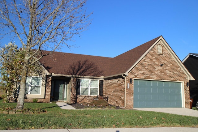 view of front of house with a front lawn and a garage