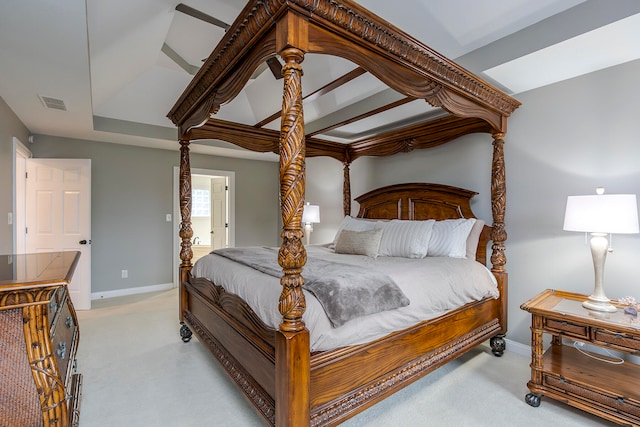 carpeted bedroom with ensuite bathroom