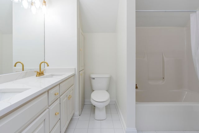 bathroom featuring tile patterned flooring, vanity, and toilet