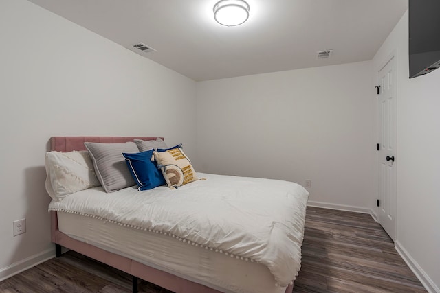 bedroom featuring dark hardwood / wood-style floors