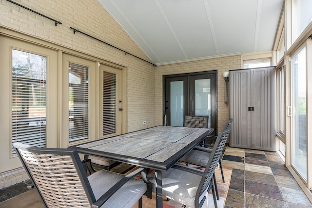 sunroom with lofted ceiling