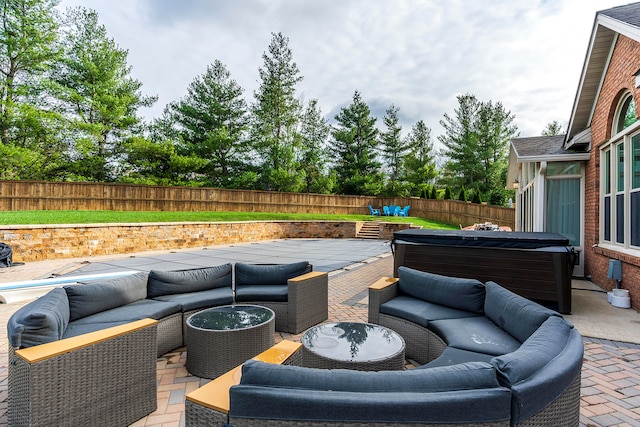 view of patio featuring an outdoor hangout area and a hot tub