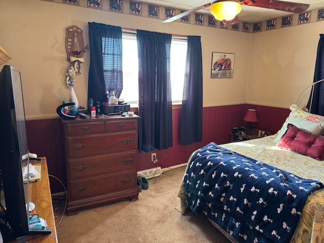 bedroom with ceiling fan and light colored carpet