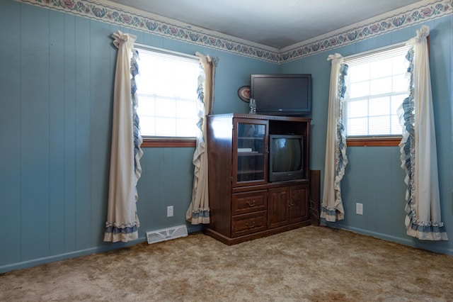 unfurnished bedroom featuring carpet flooring and visible vents