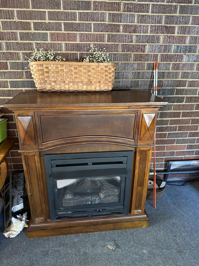 details featuring carpet flooring and a fireplace