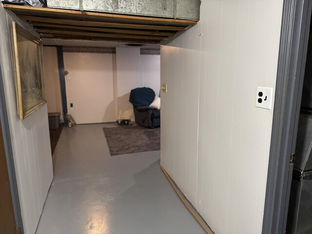 basement with a textured ceiling and bar