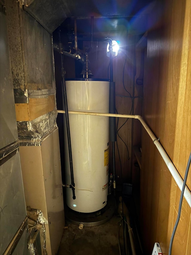 utility room with water heater