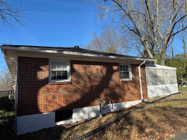 view of home's exterior featuring a sunroom