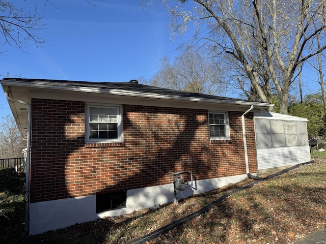 view of home's exterior featuring brick siding