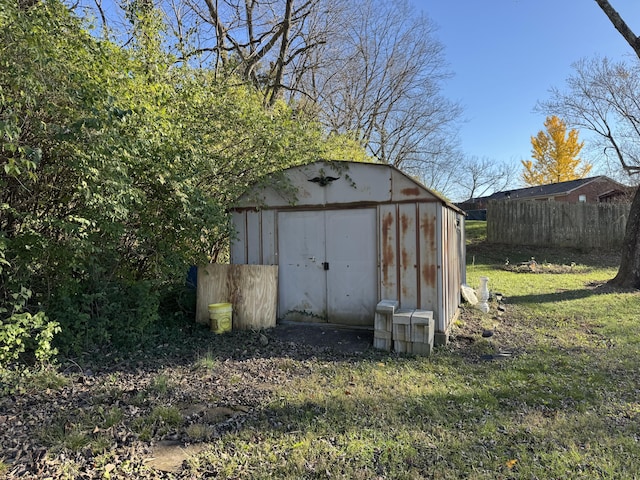 view of shed with fence