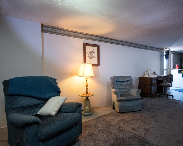 living area with a textured ceiling and carpet floors