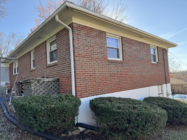 view of property exterior featuring brick siding