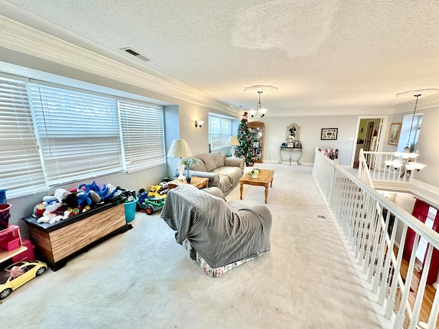 carpeted living room featuring a chandelier, a textured ceiling, and crown molding