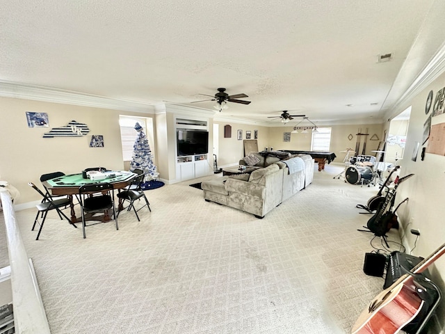 living room with crown molding, ceiling fan, light carpet, and a textured ceiling