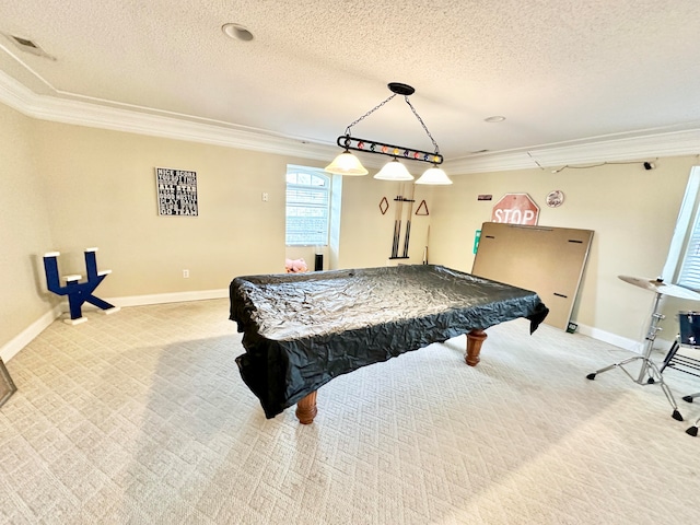 recreation room with a textured ceiling, light colored carpet, ornamental molding, and pool table