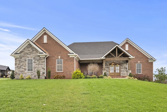 craftsman-style home with french doors and a front lawn