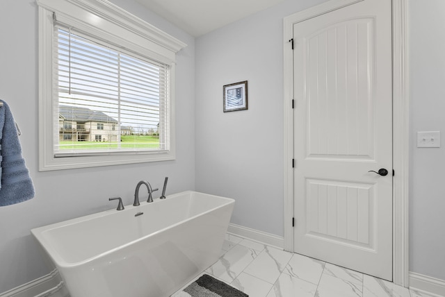 bathroom with a tub to relax in