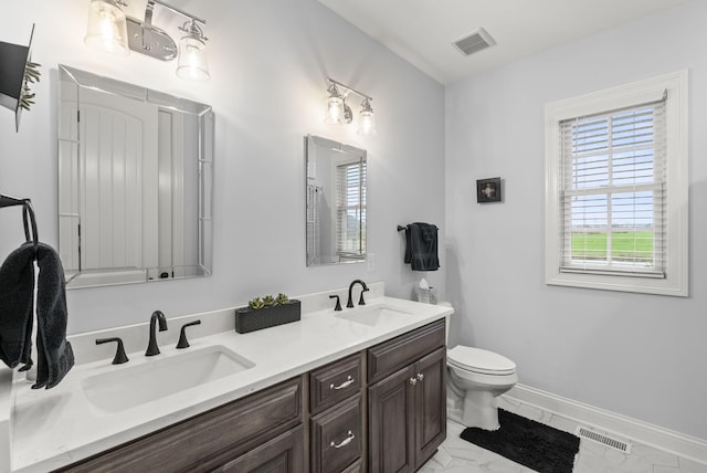 bathroom with vanity and toilet