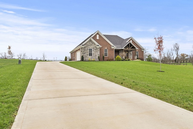 view of front of home with a garage and a front lawn