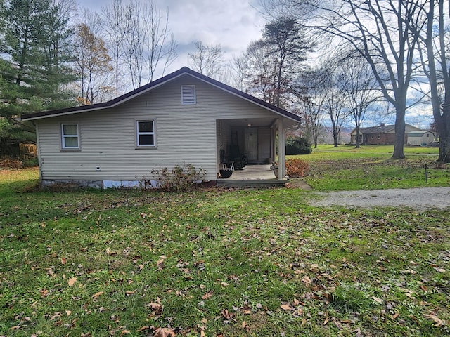 view of property exterior with a lawn