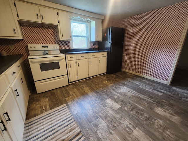 kitchen with decorative backsplash, black fridge, dark wood-type flooring, cream cabinets, and white range with electric cooktop