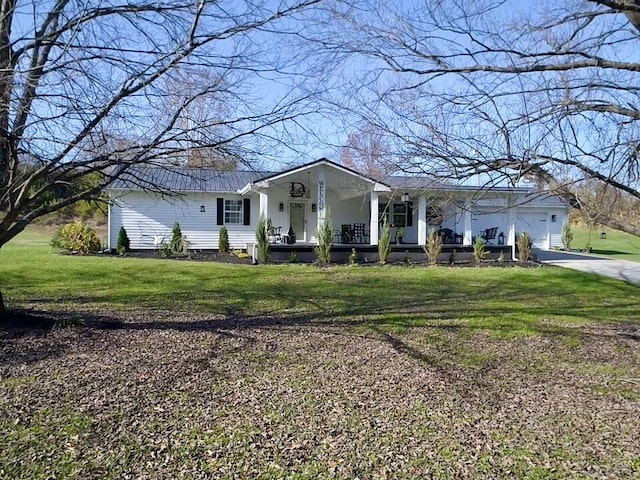 single story home with a front yard and a garage