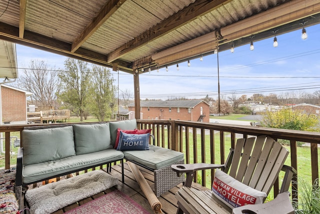 wooden terrace featuring a lawn