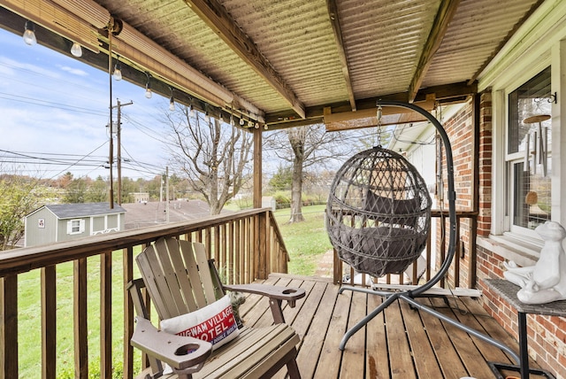 wooden deck with a lawn