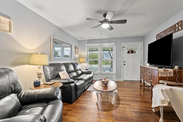 living room with dark hardwood / wood-style floors and ceiling fan