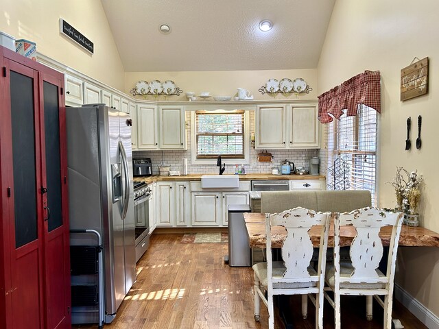 living room with hardwood / wood-style flooring and a healthy amount of sunlight