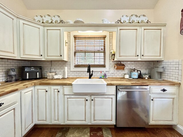 kitchen featuring hardwood / wood-style floors, a healthy amount of sunlight, and sink