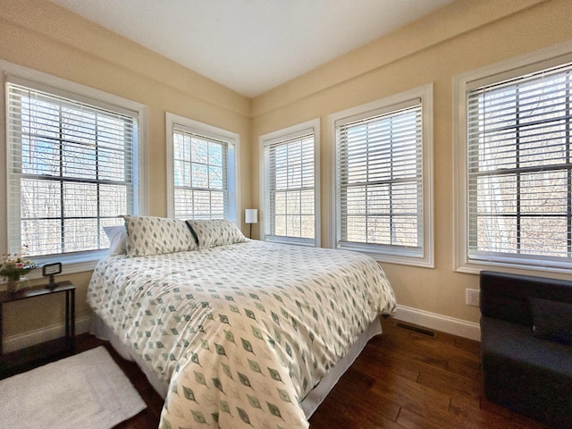 bedroom featuring dark wood-type flooring