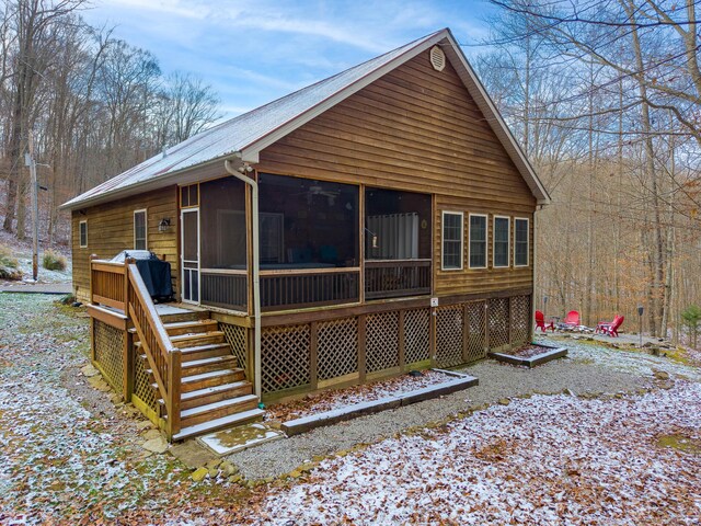 back of property featuring central AC