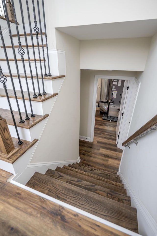 stairs featuring hardwood / wood-style flooring