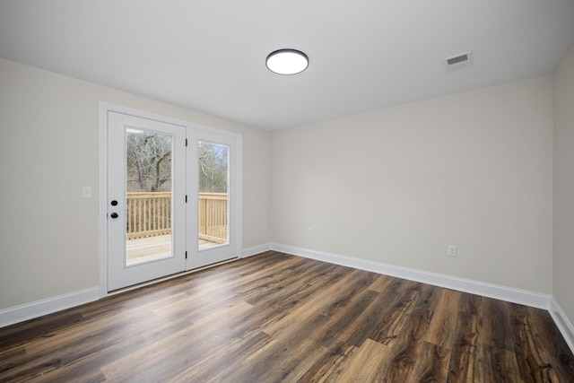 unfurnished room with dark hardwood / wood-style floors