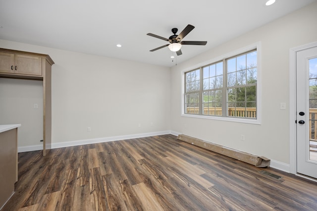 entryway with dark hardwood / wood-style flooring and ceiling fan