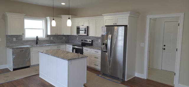 kitchen featuring a sink, dark wood-style flooring, white cabinetry, and stainless steel appliances