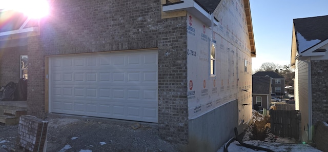 view of side of property featuring a garage