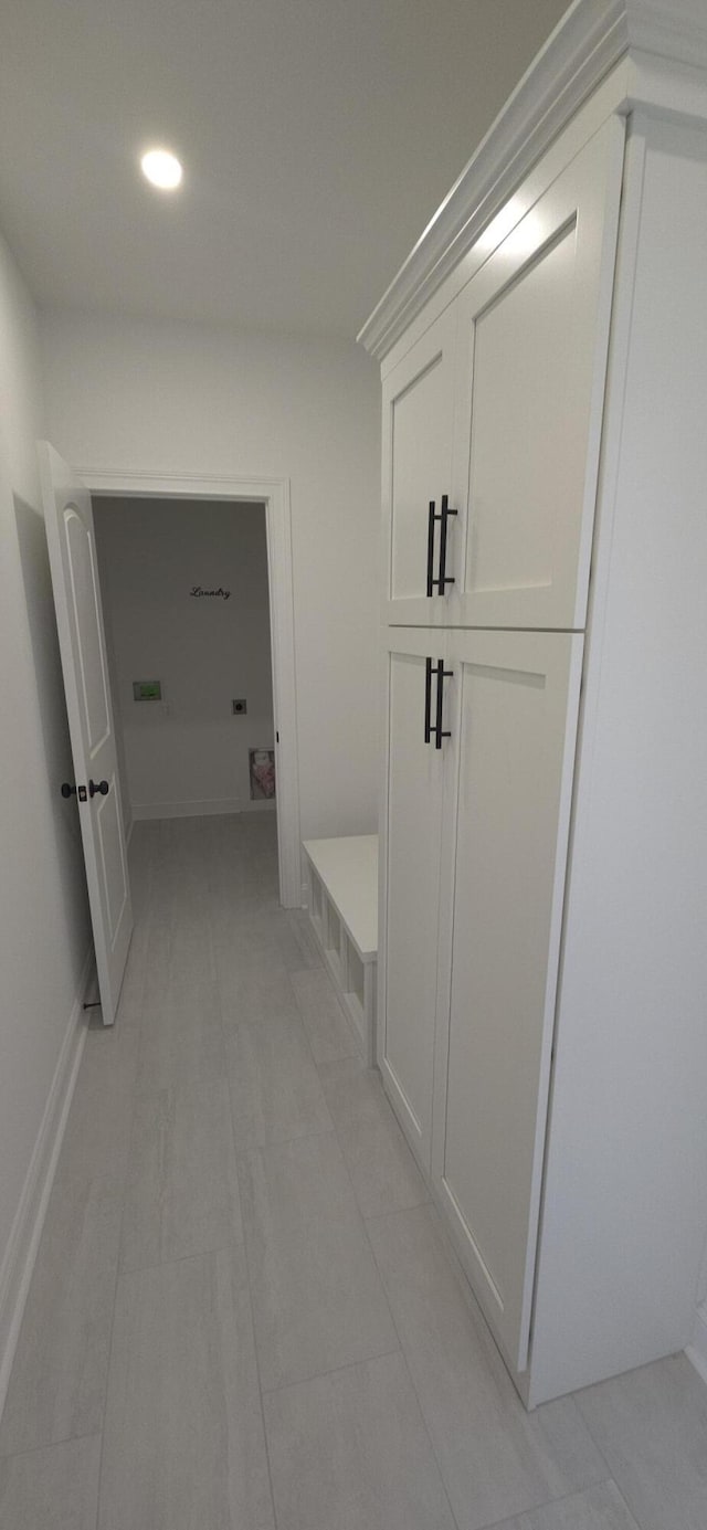 hall with light tile patterned flooring and recessed lighting