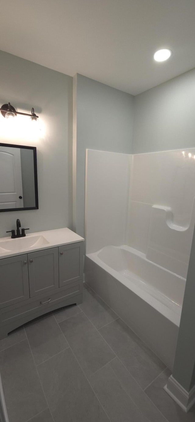 full bathroom featuring vanity and tile patterned flooring